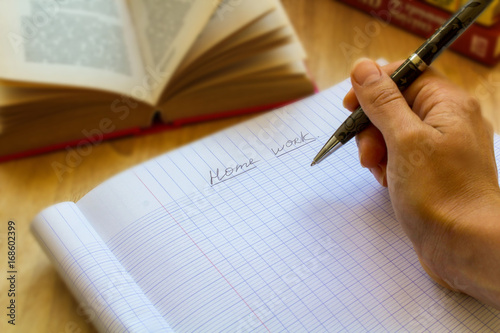puple writes his home work