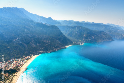 Fototapeta Naklejka Na Ścianę i Meble -  Amazing aerial view of Blue Lagoon in Oludeniz, Turkey. Summer landscape with mountains, green forest, azure water, sandy beach and blue sky in bright sunny day. Travel background. Top view. Nature