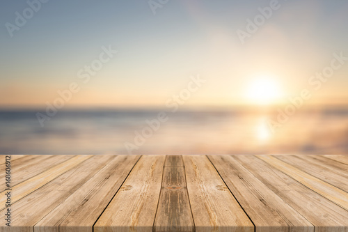 Wooden table with beach background 