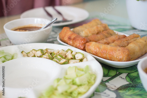 Nham nueng is vietnamese food consist of many vegetables and meatball wrapped in noodle with sauce.