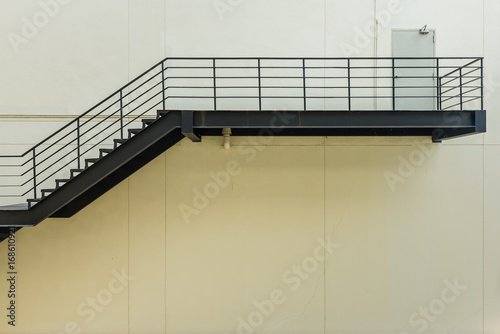 stair for fire escape with the steel railing and ladder