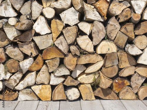 Wooden chopped firewood on the street photo