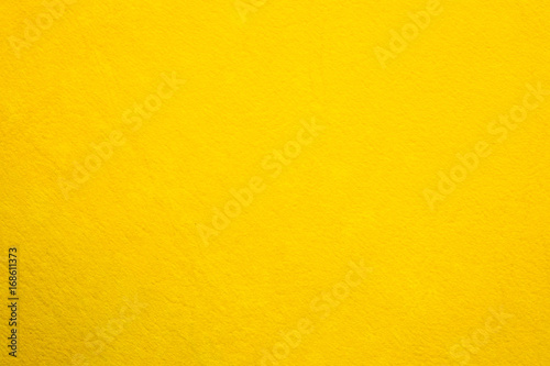 Close up the bright yellow paper texture background