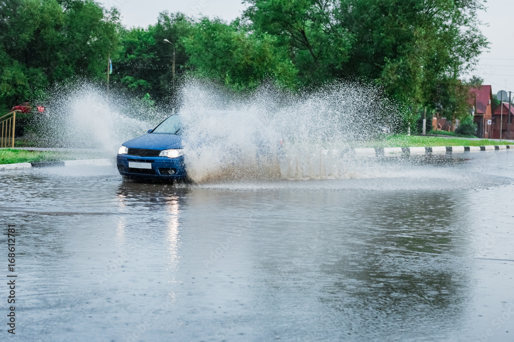 Fototapeta premium car rain puddle splashing water