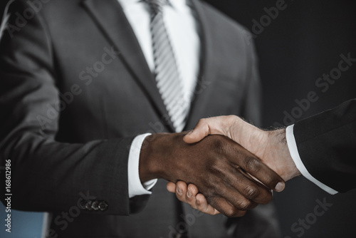 multicultural businessmen handshake