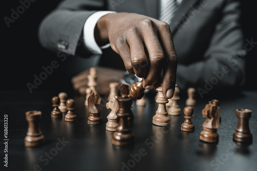 african american businessman playing chess