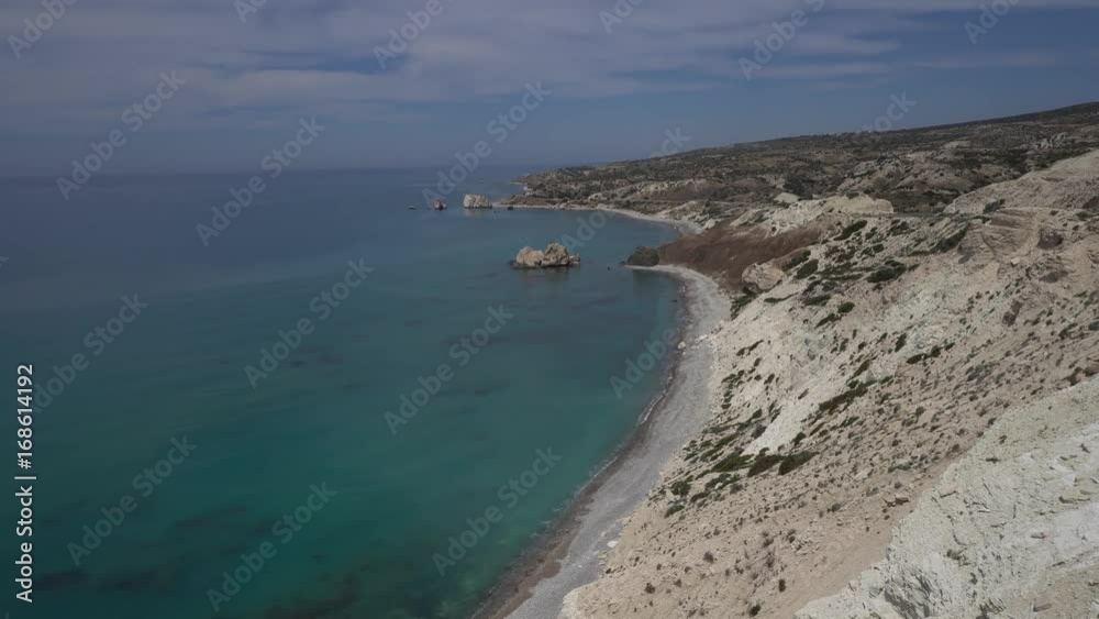 Moving towards the cliff edge and looking over wonderful transparent sea far below. POV, handheld shot Moving towards the cliff edge and looking over wonderful transparent sea far below. POV, handheld shot