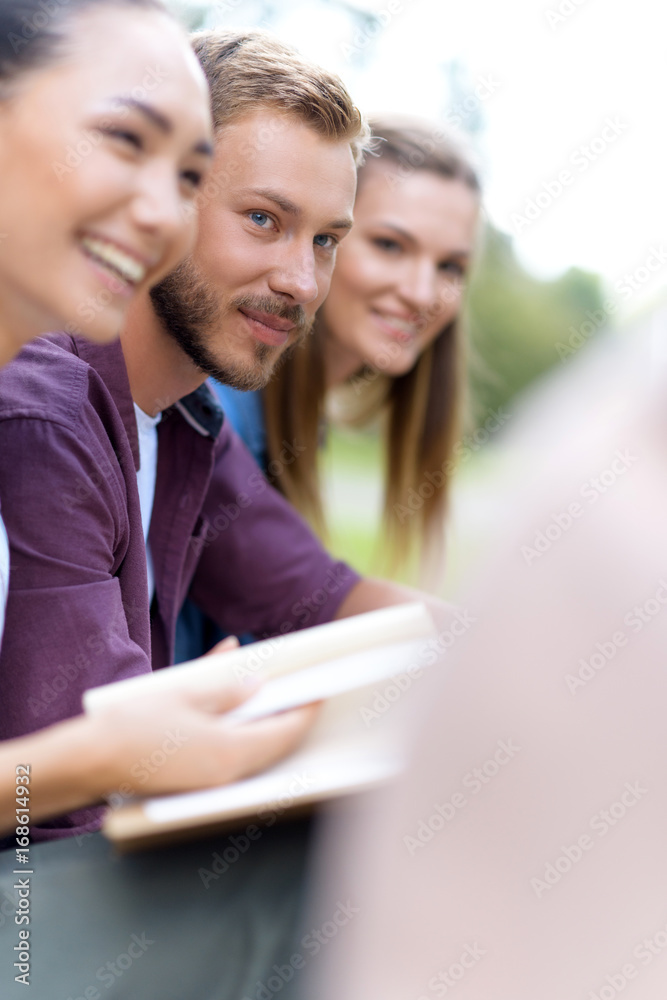 multiethnic students with book multiethnic students with book