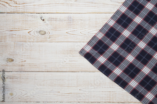 Napkin. Tablecloth tartan, checkered, dish towels on white wooden table background top view mock up