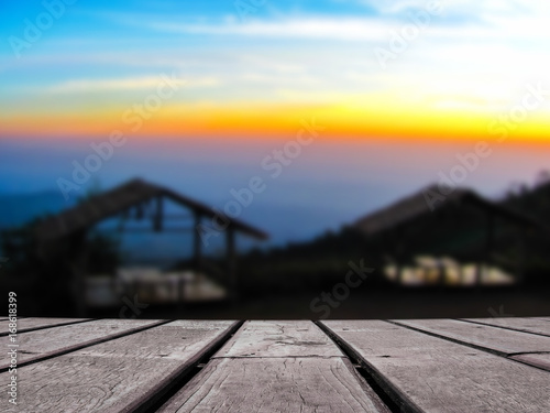 Wooden floor with blurred landscape nature view in the background