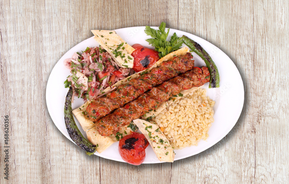 Kebab plate with bulgur and pepper