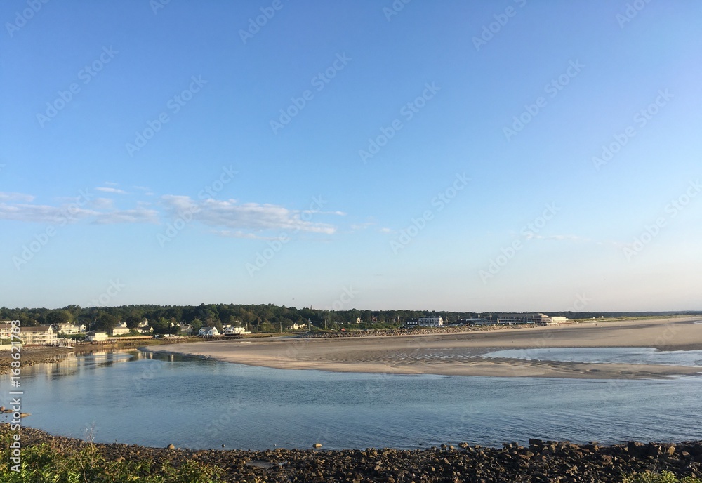 early morning view of the Ogunquit river flowing into the ocean in southern Maine