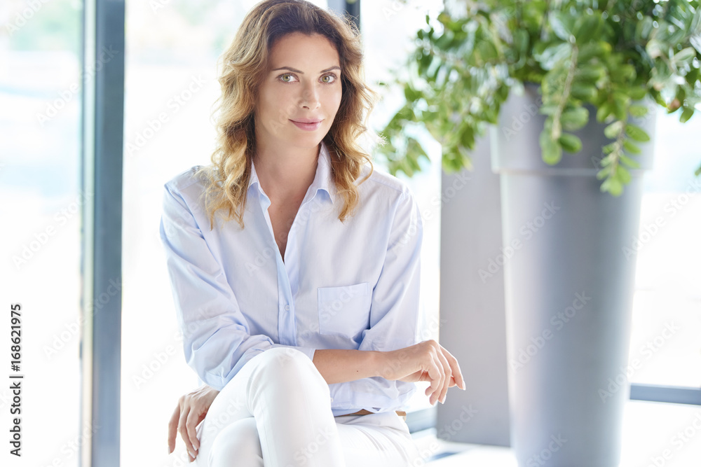 Attractive woman portrait. Close-up portrait shot of beautiful young businesswoman sitting at the office. Attractive woman portrait. Close-up portrait shot of beautiful young businesswoman sitting at the office.