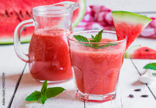 Fresh watermelon juice on wooden table