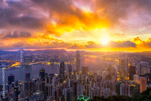 Hong Kong City skyline at sunrise. from night to day