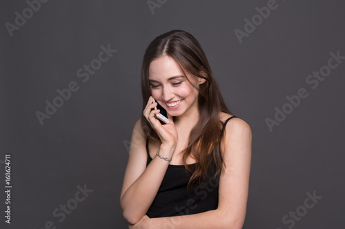 Smiling beautiful woman talking on phone