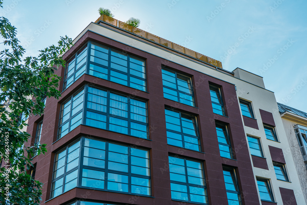 big apartment building with blue panorama windows big apartment building with blue panorama windows