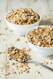 Two Bowls of Almond Granola With Spoon Vertical