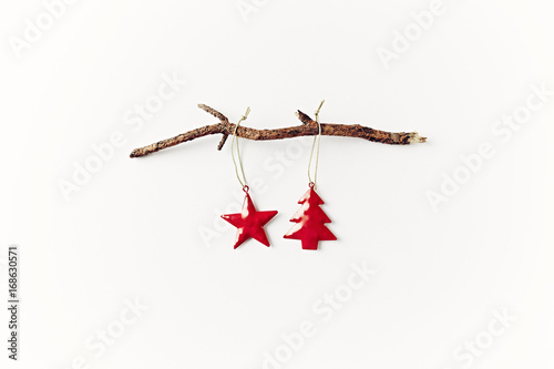 Two Christmas Tree Decorations on a Dry Tree Branch