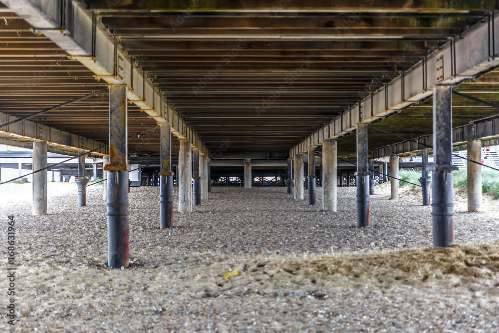 Fototapeta premium Large wooden jetty of a beach of the English east coast