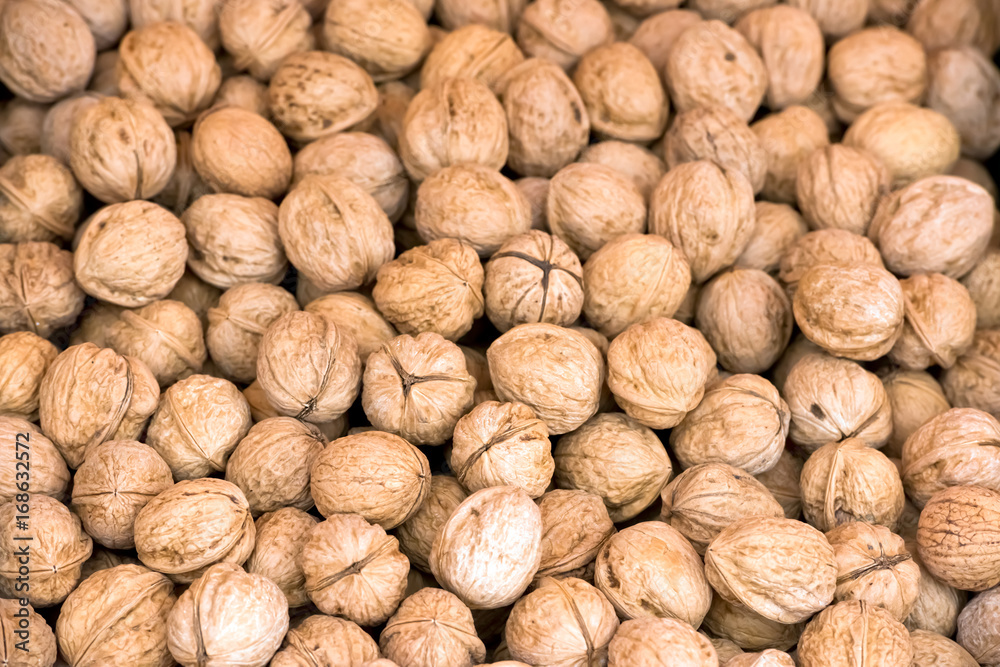 Whole walnuts background texture