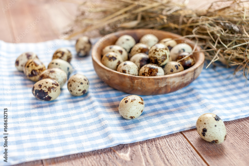 Quail eggs on the old rustic wooden table. Quail eggs on the old rustic wooden table.