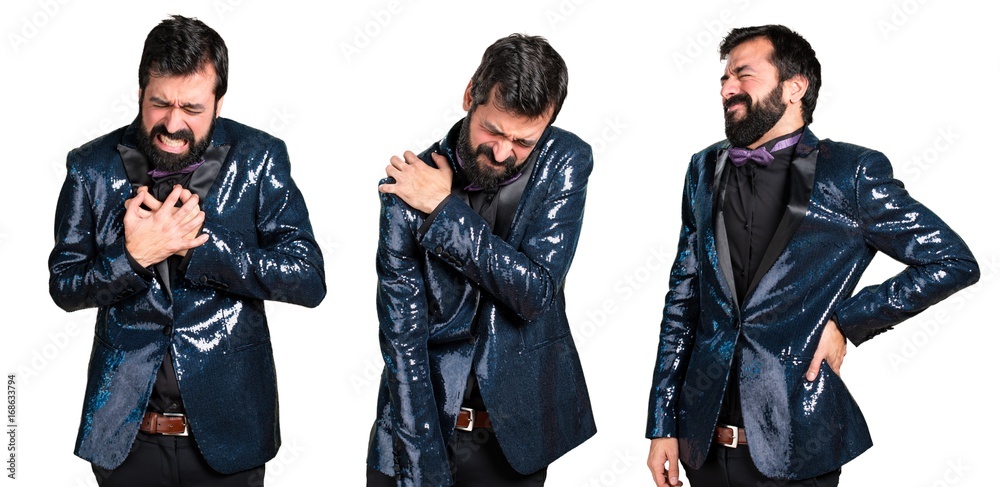 Handsome man with sequin jacket with shoulder pain, back pain and heart pain Handsome man with sequin jacket with shoulder pain, back pain and heart pain