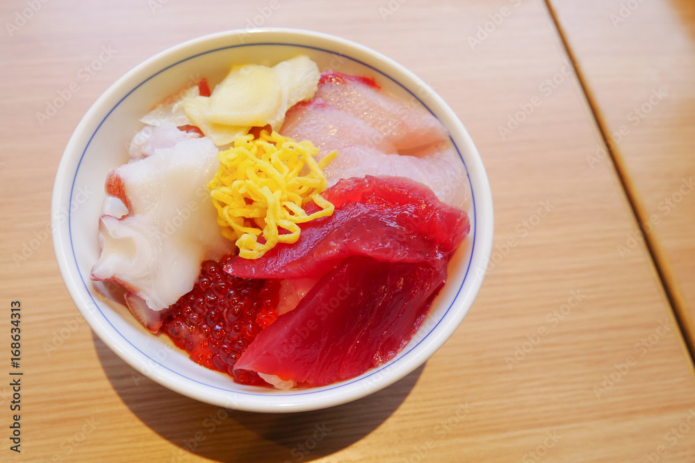 Sush sashimii rice bowl with octopus , Hamachi ,Tuna and ikura salmon egg roe Sush sashimii rice bowl with octopus , Hamachi ,Tuna and ikura salmon egg roe