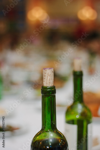 Bottle neck of red wine closed by cork