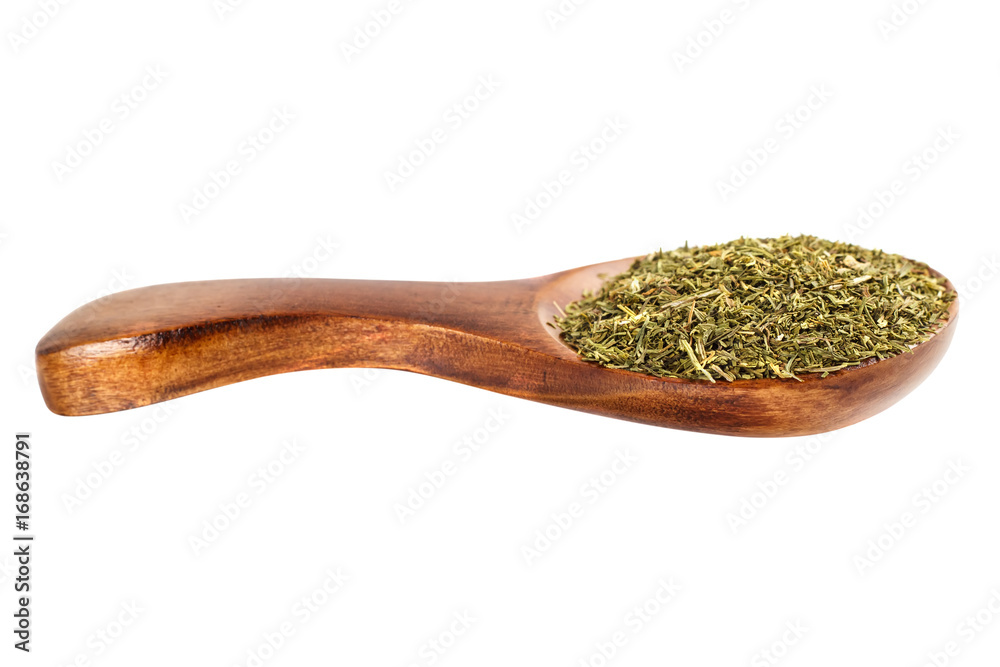Dried fennel in a wooden spoon on a white background Dried fennel in a wooden spoon on a white background