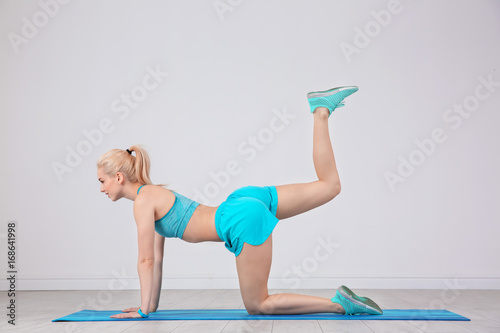 Sporty young woman training...