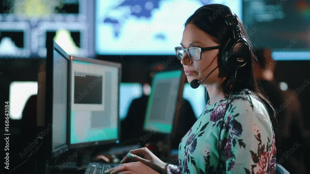 Attractive woman customer support phone operator at workplace