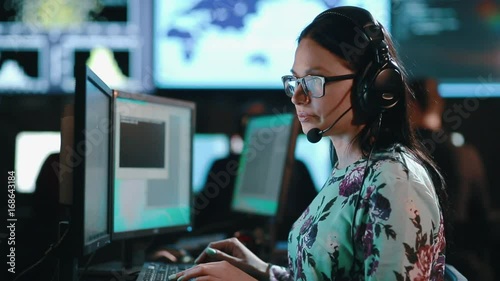 Attractive woman customer support phone operator at workplace