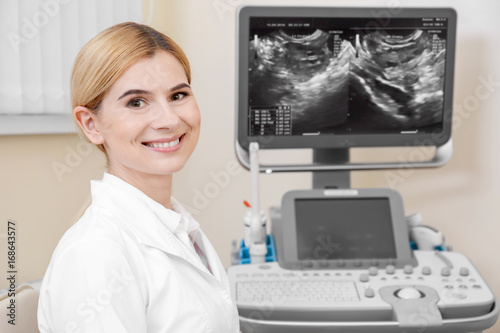 Female ultrasonographer in modern clinic