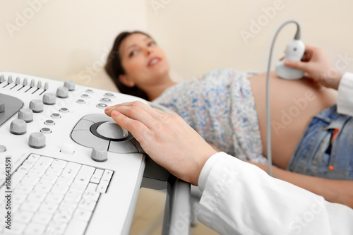 Doctor conducting ultrasoun...