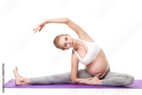 Portrait Of Pregnant Woman Doing Yoga