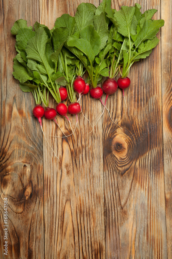 Radishes on a wooden background Radishes on a wooden background