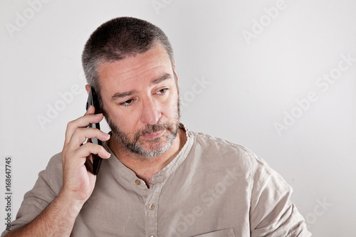 Mature man talking over the cell phone