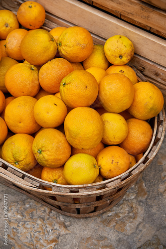Street vendors sell vegetables, fruits on old european street photo