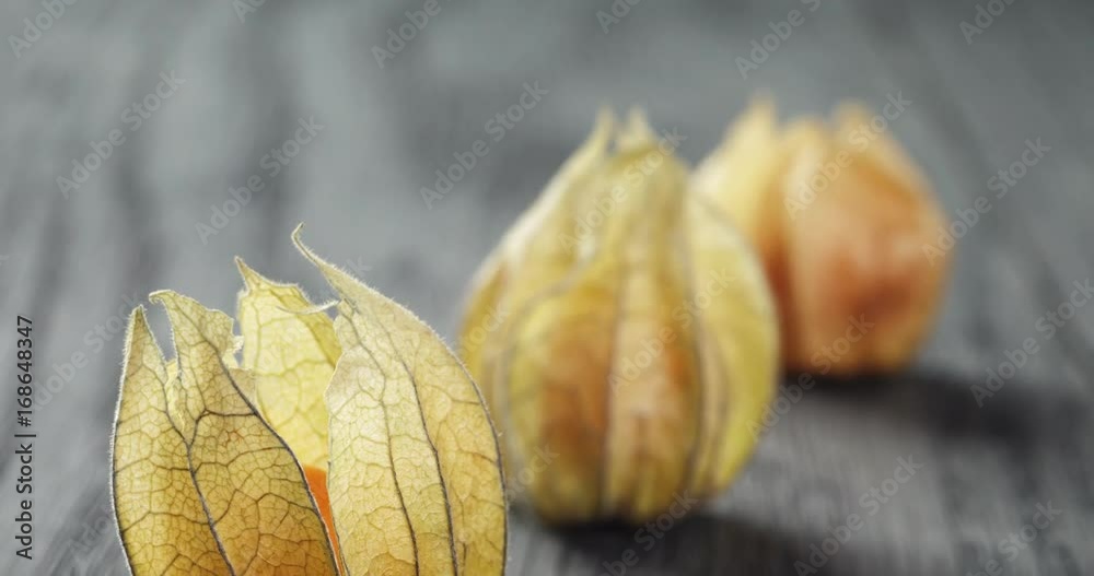 Physalis fruit on oak wooden table Physalis fruit on oak wooden table