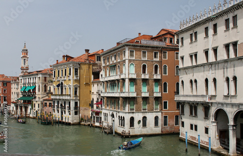 Buildings and gondolas on the street in Venice.