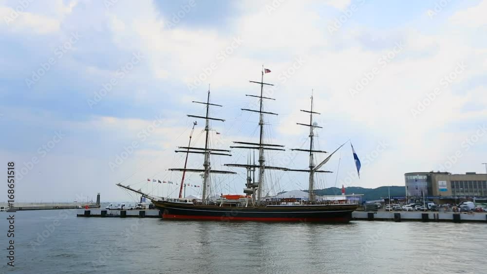 Pleasure vessel with tourists on board ready to leave harbor for open sea voyage Pleasure vessel with tourists on board ready to leave harbor for open sea voyage