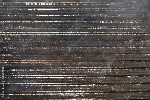 burning of a empty pig-iron frying pan grill