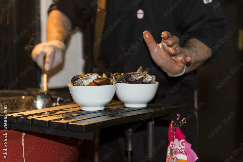 chef preparing seafood on the grill chef preparing seafood on the grill