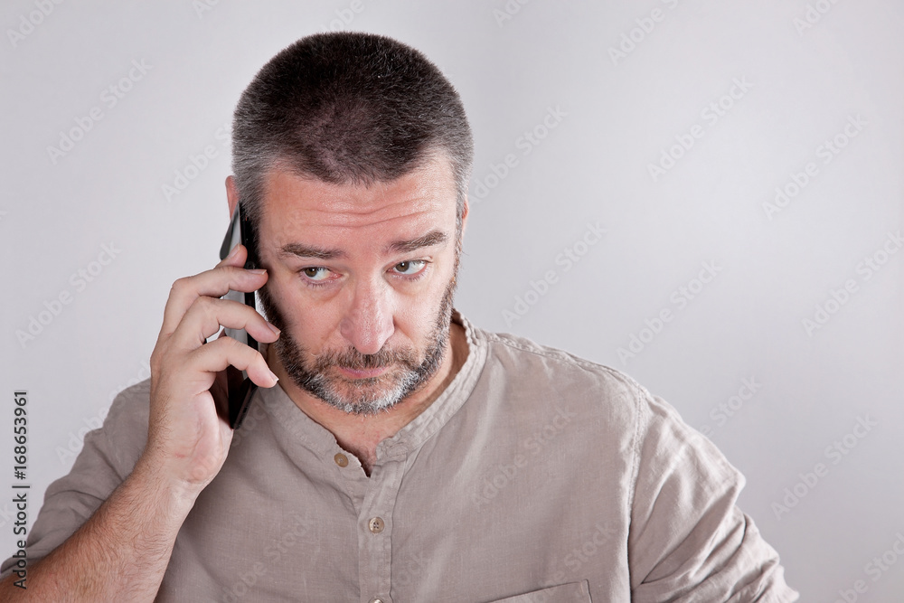 Mature man talking over the cell phone Mature man talking over the cell phone