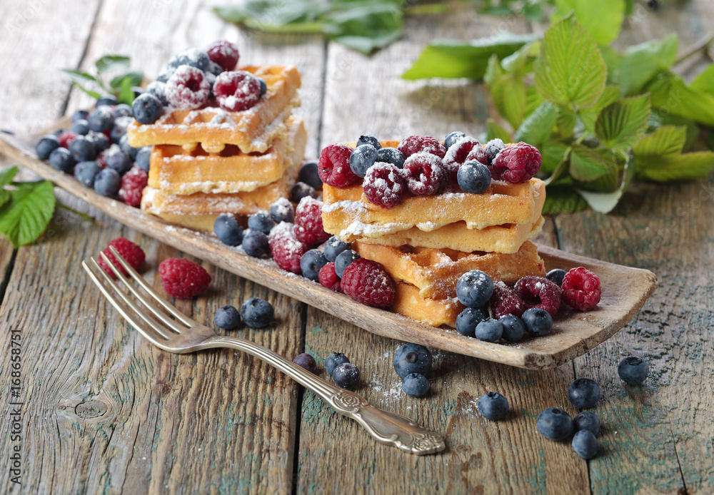 Fototapeta premium Waffles with raspberry and blueberry