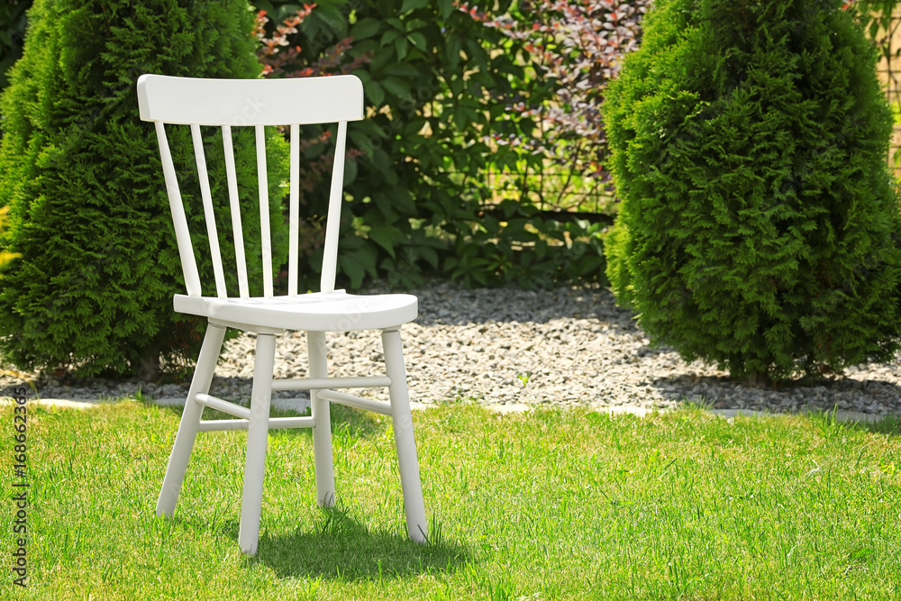 Comfortable chair on green grass in park Comfortable chair on green grass in park