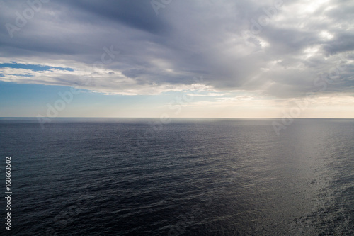 Sea and the cloudy sky