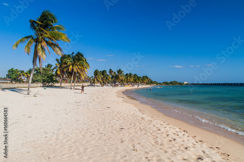 Fototapeta Naklejka Na Ścianę i Meble -  PLAYA GIRON, CUBA - FEB 14, 2016: Tourists at the beach Playa Giron, Cuba. This beach is famous for its role during the Bay of Pigs invasion.