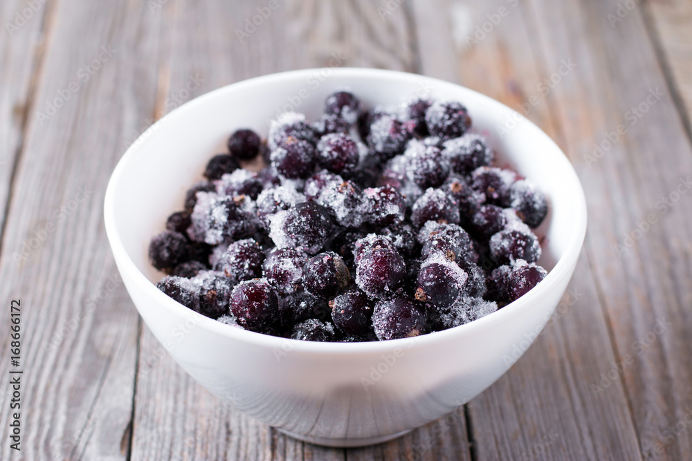 Frozen black currant in a bowl Frozen black currant in a bowl